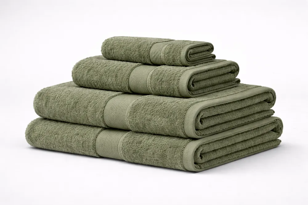 Folded bath towels in sand, sage and navy